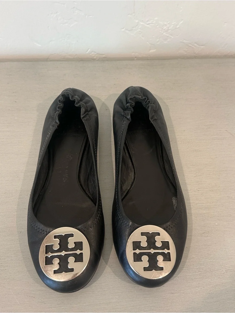 Tory Burch Black Leather Logo Ballet Flats with Silver Emblem Reva